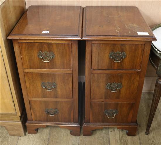 A pair of walnut three drawer bedside chests W.35cm